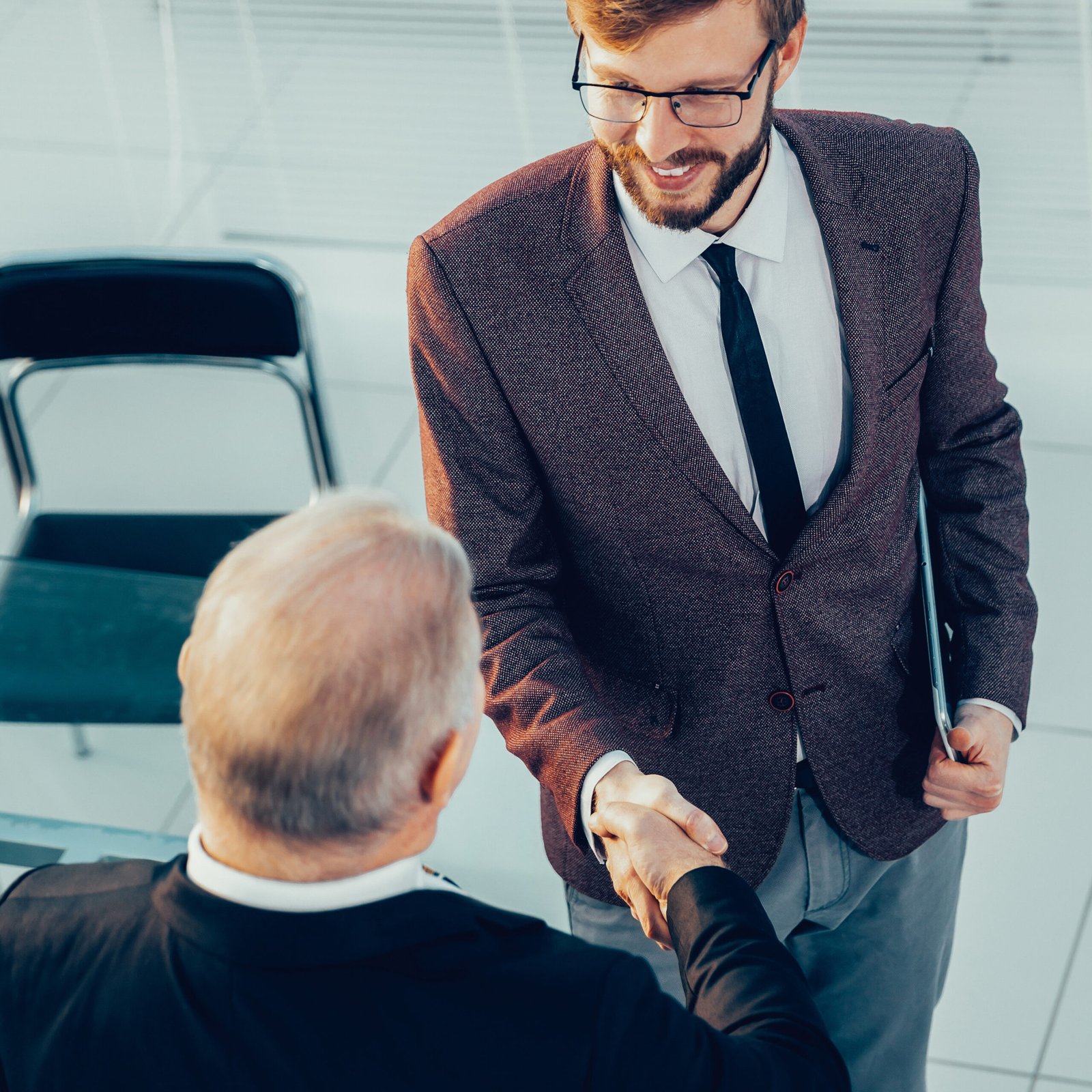top view. business colleagues shaking hands with each other.